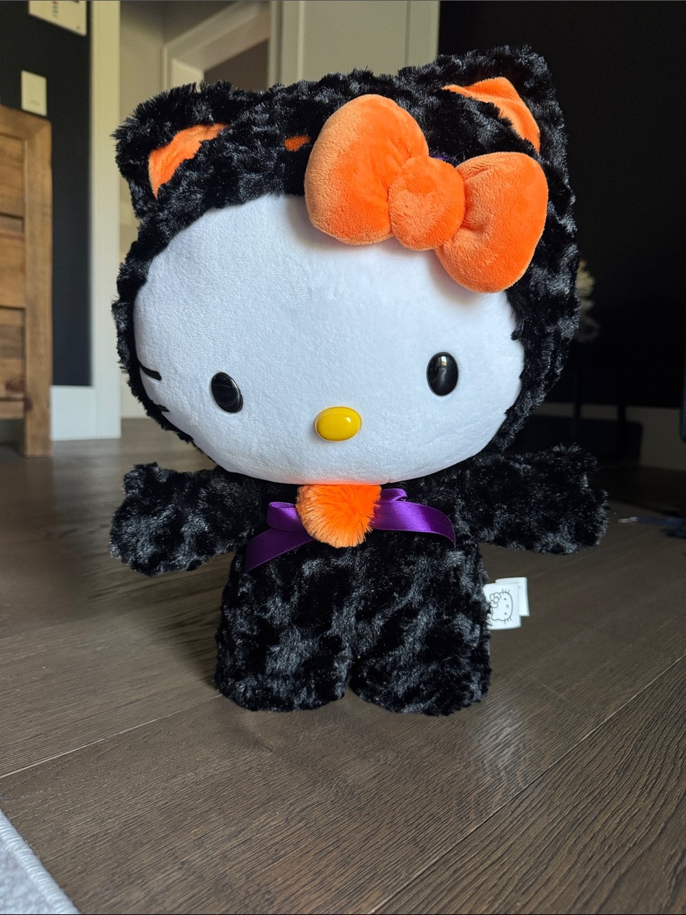 Sanrio Hello Kitty Black & Orange Plush Costume with Purple Bow